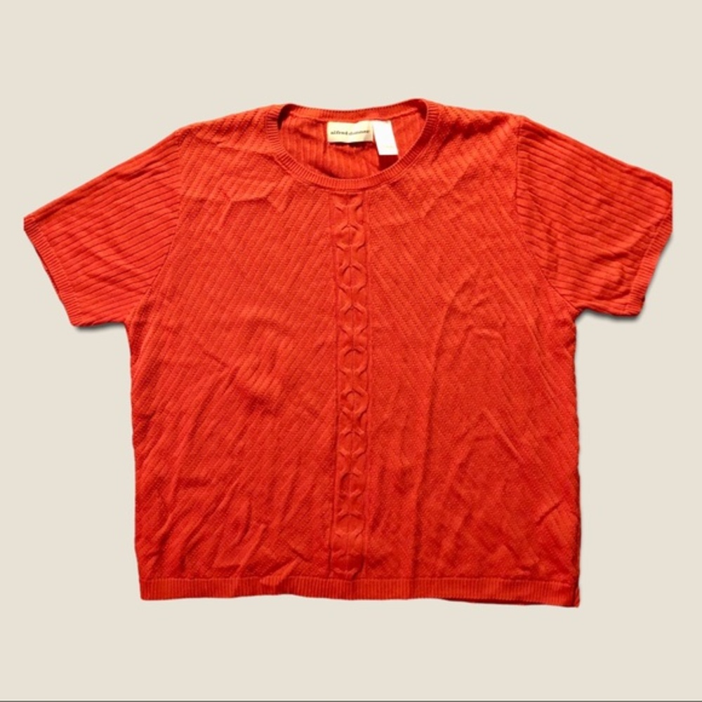 Short sleeve orange sweater with detail in center,Great Condition, Size Large